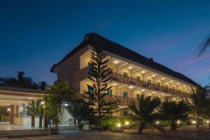 a large building with lights on it at night at South Beach Resort in Dar es Salaam