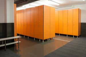 a row of orange lockers in a room at Hotel Caribou in Pas de la Casa