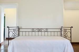 Postel nebo postele na pokoji v ubytování Casa alla Vecchia Posta di Bagno Vignoni