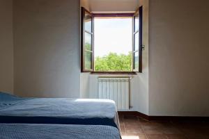 Postel nebo postele na pokoji v ubytování Casa alla Vecchia Posta di Bagno Vignoni