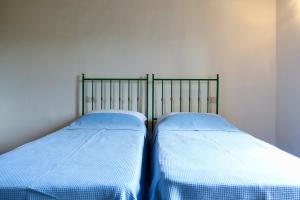 Postel nebo postele na pokoji v ubytování Casa alla Vecchia Posta di Bagno Vignoni