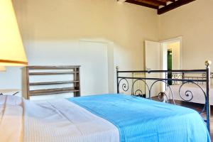 Postel nebo postele na pokoji v ubytování Casa alla Vecchia Posta di Bagno Vignoni