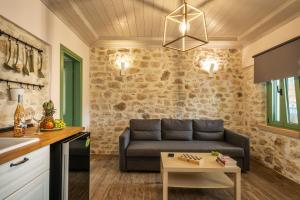 a living room with a couch and a table at Bellou Villas Sivota in Syvota