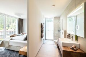 Postel nebo postele na pokoji v ubytování MANNI village - lifestyle apartments