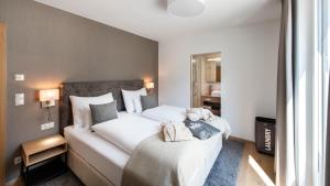 Postel nebo postele na pokoji v ubytování MANNI village - lifestyle apartments