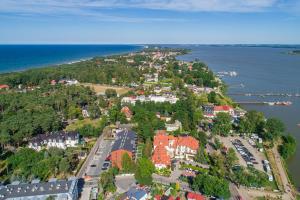 an aerial view of a town next to the water at Rezydencja Park - City Apartments in Mielno