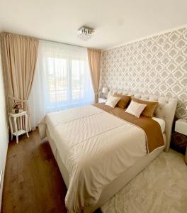 a bedroom with a large bed in a room at Die Oase - Luxurious Apartment near the City Center in Bratislava