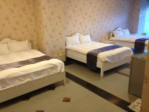 Letto o letti in una camera di 礁溪景觀溫泉會館