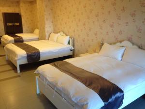 Letto o letti in una camera di 礁溪景觀溫泉會館