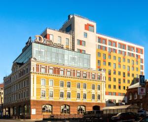 a building with a sign on the top of it at Business Hotel Diplomat in Nizhny Novgorod