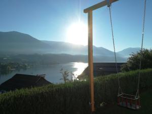 a swing with a view of a river at Ferienwohnung Kerschbaumer in Seeboden