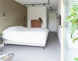 Letto o letti in una camera di Onze Kas