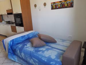 Postel nebo postele na pokoji v ubytování Casa Vacanze I Due Delfini