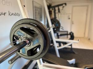 a barbell in a gym with several machines at HOTEL SØMA Sisimiut in Sisimiut