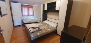 Postel nebo postele na pokoji v ubytování Apartmani Barbara App2