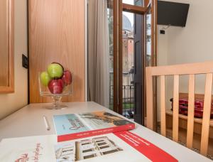 TV a/nebo společenská místnost v ubytování Hotel Casa Del Pellegrino