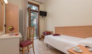 Postel nebo postele na pokoji v ubytování Hotel Casa Del Pellegrino