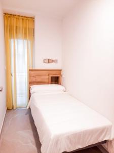 Łóżko lub łóżka w pokoju w obiekcie Bonefish Apartment