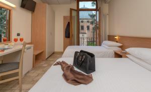 Postel nebo postele na pokoji v ubytování Hotel Casa Del Pellegrino + 37 fotografií