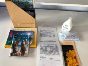 a table with some books and a bottle of milk at CASA CALMA in La Pared