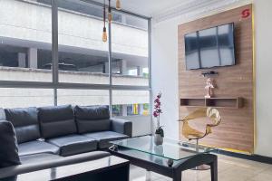 TV a/nebo společenská místnost v ubytování Hotel Suite Center Pereira