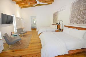 Ibagari Boutique Hotel客房内的一张或多张床位