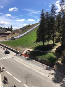 an aerial view of a road with trees on a hill at 3 pièces de grand standing aux pieds des pistes Valberg in Valberg