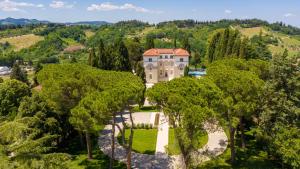 an aerial view of a mansion in the trees at Agri Resort Villa Monty Banks in Cesena