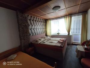 Posteľ alebo postele v izbe v ubytovaní Motel Podkova