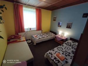 Posteľ alebo postele v izbe v ubytovaní Motel Podkova
