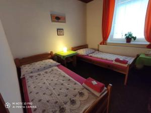 Posteľ alebo postele v izbe v ubytovaní Motel Podkova
