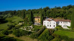 an aerial view of a mansion with trees at Borgo il Mezzanino in Salò
