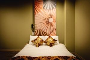 Postelja oz. postelje v sobi nastanitve HOTEL BLAX