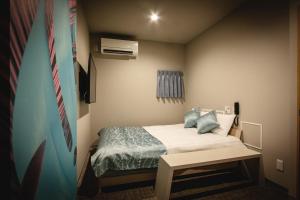 Postelja oz. postelje v sobi nastanitve HOTEL BLAX