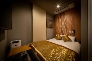 Postelja oz. postelje v sobi nastanitve HOTEL BLAX