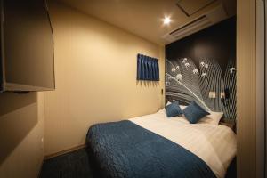 Postelja oz. postelje v sobi nastanitve HOTEL BLAX