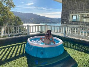 a woman and a child in a hot tub at Kizkitza in Gautegiz Arteaga +18 photos