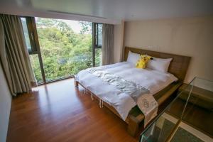 Letto o letti in una camera di 礁溪景觀溫泉會館