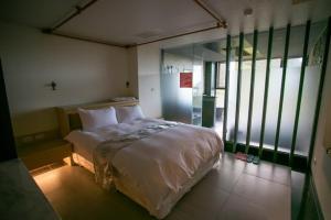 Letto o letti in una camera di 礁溪景觀溫泉會館