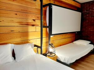 
Cama o camas de una habitación en Hostal Erasmus by gaiarooms
