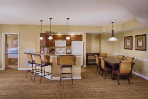 a kitchen and dining room with a table and chairs at Club Wyndham Bonnet Creek in Orlando