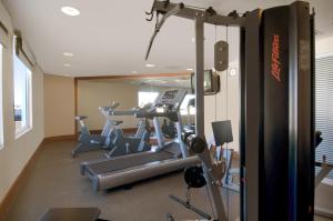 a gym with several tread machines in a room at Fiesta Inn Mexicali in Mexicali