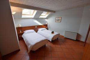 Ένα ή περισσότερα κρεβάτια σε δωμάτιο στο Residence Del Messaggero
