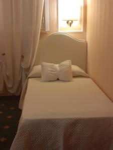 Postel nebo postele na pokoji v ubytování Boutique Hotel Puccini