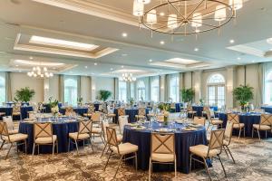 a ballroom with tables and chairs in a room at The Inn at Elon in Elon