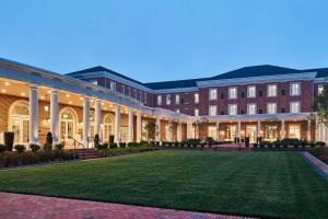 a large building with a lawn in front of it at The Inn at Elon in Elon