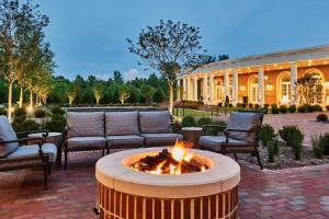 a fire pit in the middle of a patio at The Inn at Elon in Elon