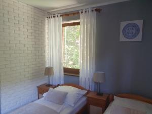 Posteľ alebo postele v izbe v ubytovaní Willa Kora