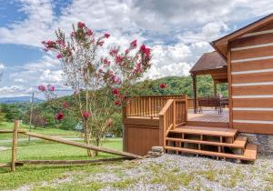 a wooden cabin with a porch and a deck at Amazing Grace-Get 951 worth of FREE area attraction tickets for each paid day!!! in Sevierville