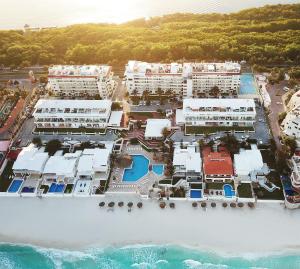 an aerial view of a resort on the water at Brisas Shores Beachfront connecting apartments, Cancun Hotel Zone in Cancún
